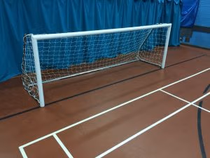12 x 4 indoor folding football goals with freestanding aluminium frames inside a sports hall