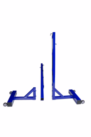 Freestanding badminton posts on wheels installed inside a sports hall badminton court