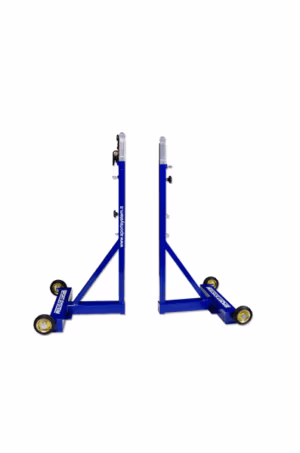 Professional height adjustable badminton posts on wheels installed inside a sports hall badminton court