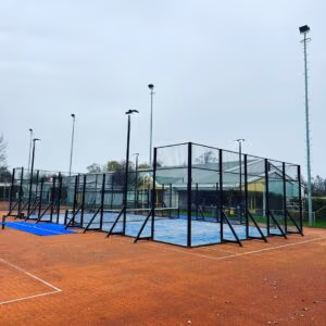 Freestanding classic outdoor padel court with glass walls and artificial turf