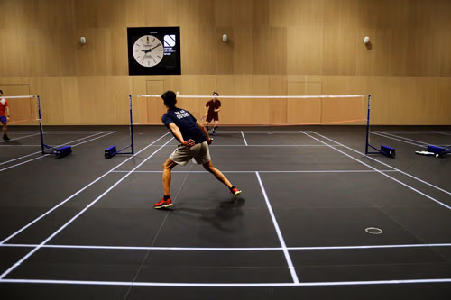 LED sprung glass sports floor installation with switchable court markings for sports halls and arenas