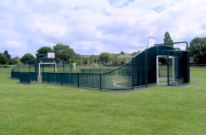 Arched end MUGA with curved sports fencing