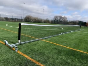 Portable tennis posts with non-marking wheels