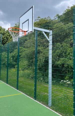 Fixed arm basketball post with steel backboard